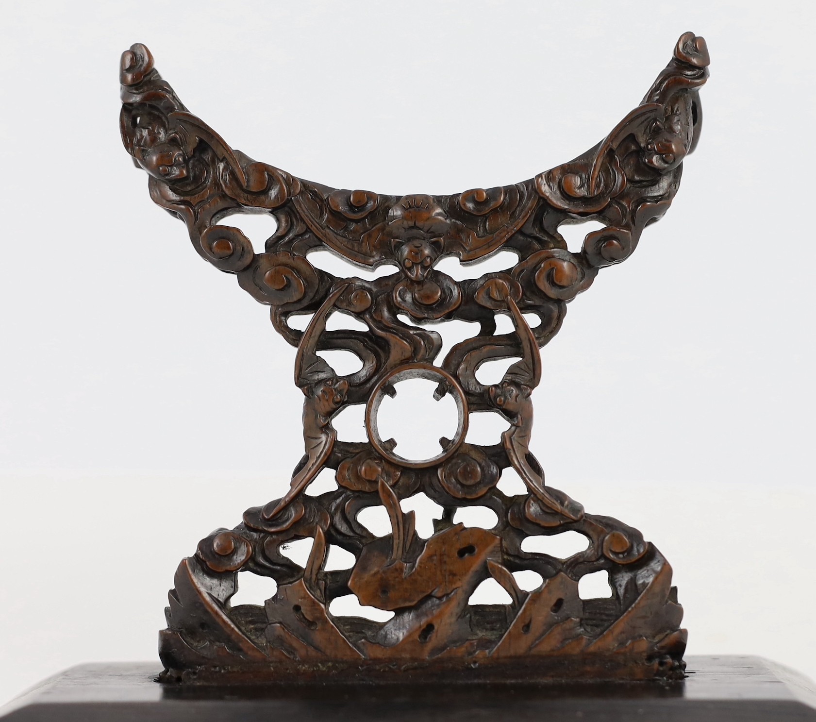 A Chinese zitan stand for a circular plaque, 18th/19th century, 15.5cm high 18cm wide